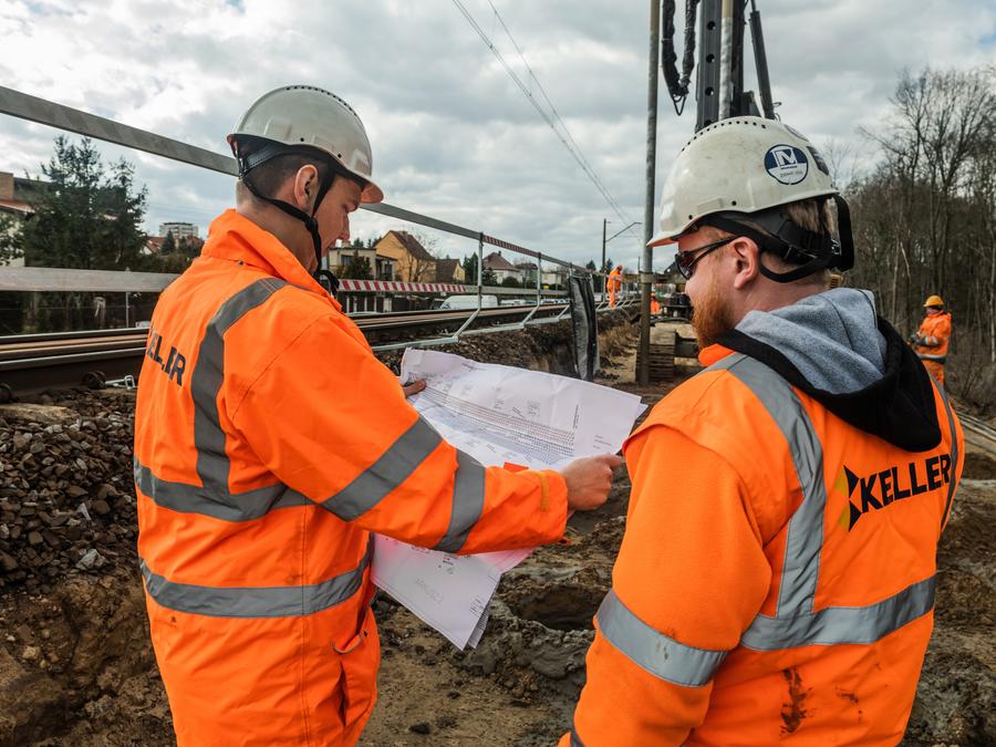 Keller engineers on site studying a plan